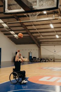 supplemental needs trust, image of a man in a wheelchair shooting a basketball