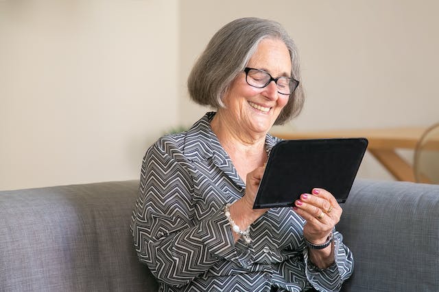 Medicaid, image of woman with a tablet
