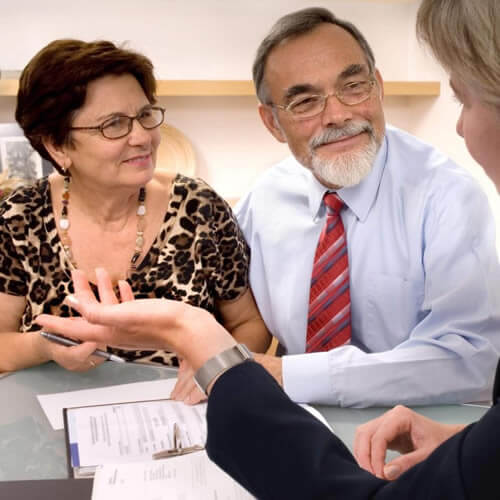 Husband and wife meeting with an attorney; Medicaid Planning