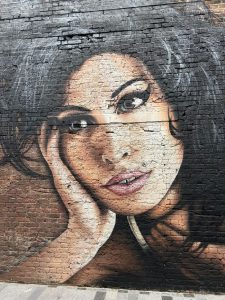 Amy Winehouse estate, image of mural of Amy Winehouse painted on a wall