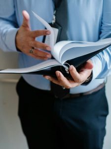 Louisiana succession process, image of man thumbing through a binder