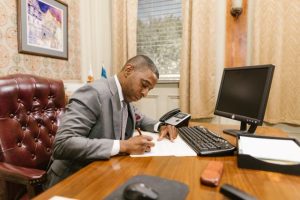 Trust Administration in Louisiana, image of well-dressed professional man working at his desk