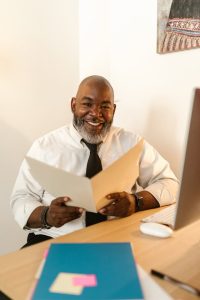 Louisiana forced heirship, image of a man wearing a tie smiling in an office